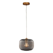 Cygnus Pendant Light Collection features a translucent elongated ribbed glass shade that creates an eye-catching glow. Hanging from a rich gold tone brass finish canopy that enhances its modern sophistication. Place over dining areas, seating areas, and more for a dramatic look. Its versatile look can complement most any room style.